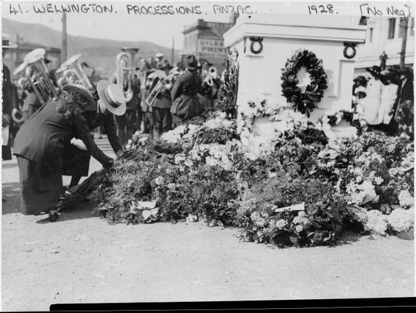 Anzac Day wreaths at the temporary cenotaph, corner of Molesworth Street and Lambton Quay, Wellington.1928